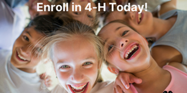 group of children with arms around each other's shoulders smiling at the camera